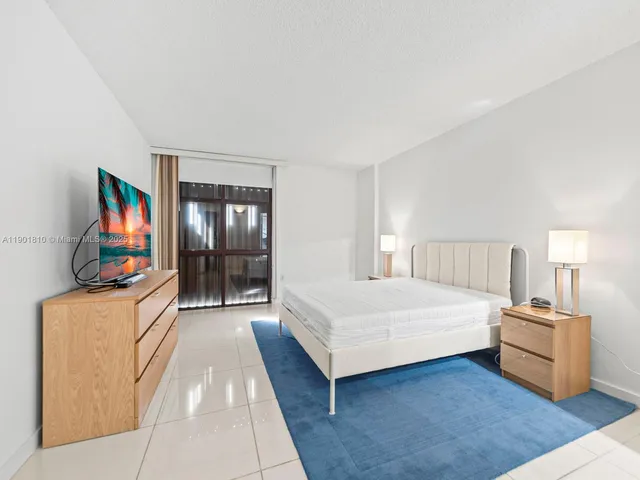 a utility room with cabinets washer and dryer