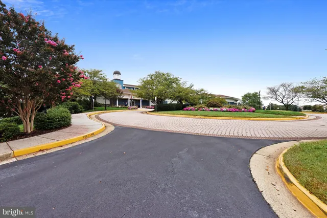 a view of a swimming pool with an outdoor space and seating area