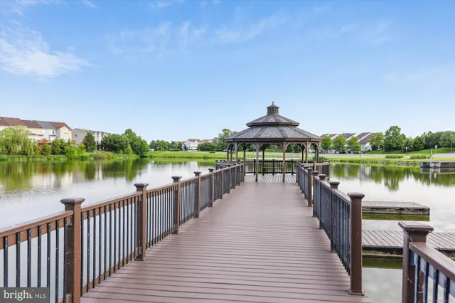 a lake view with a wooden bridge