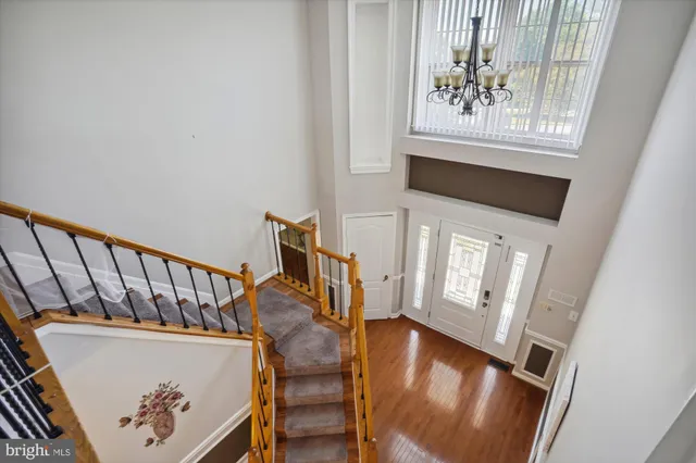a view of an entryway with wooden floor