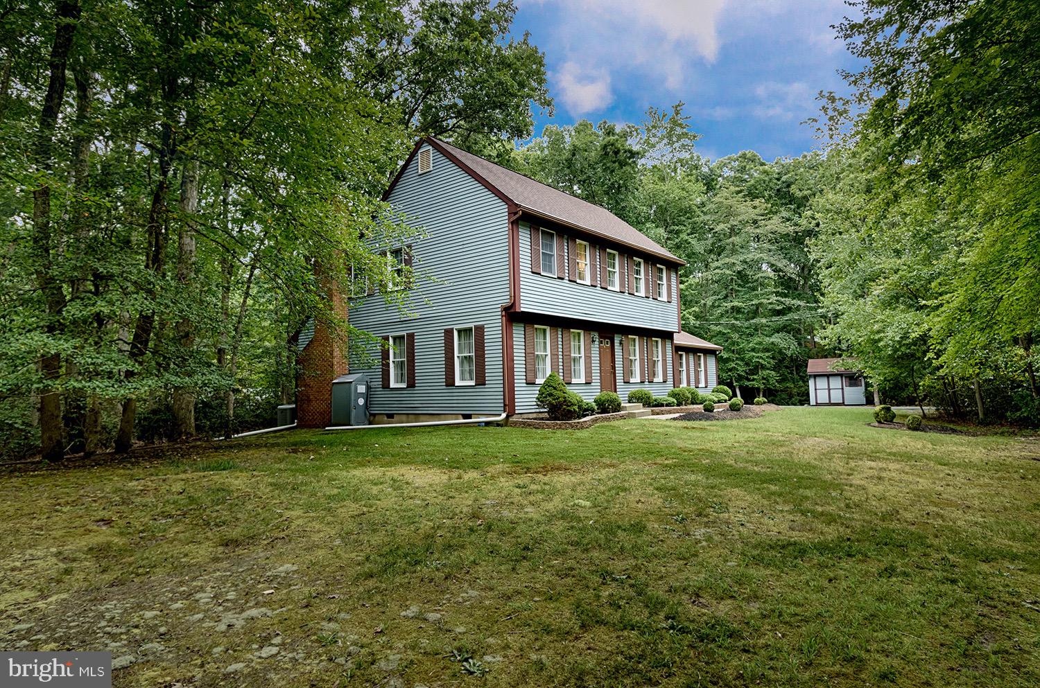 19 New Road Tabernacle, NJ 08088 - Photo 3 of 25 a view of a big house with a big yard and large trees