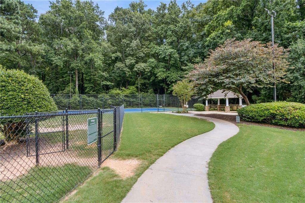 3155 Seven Pines, Unit 303 Atlanta, GA 30339 - Photo 25 of 25 a view of a garden with trees