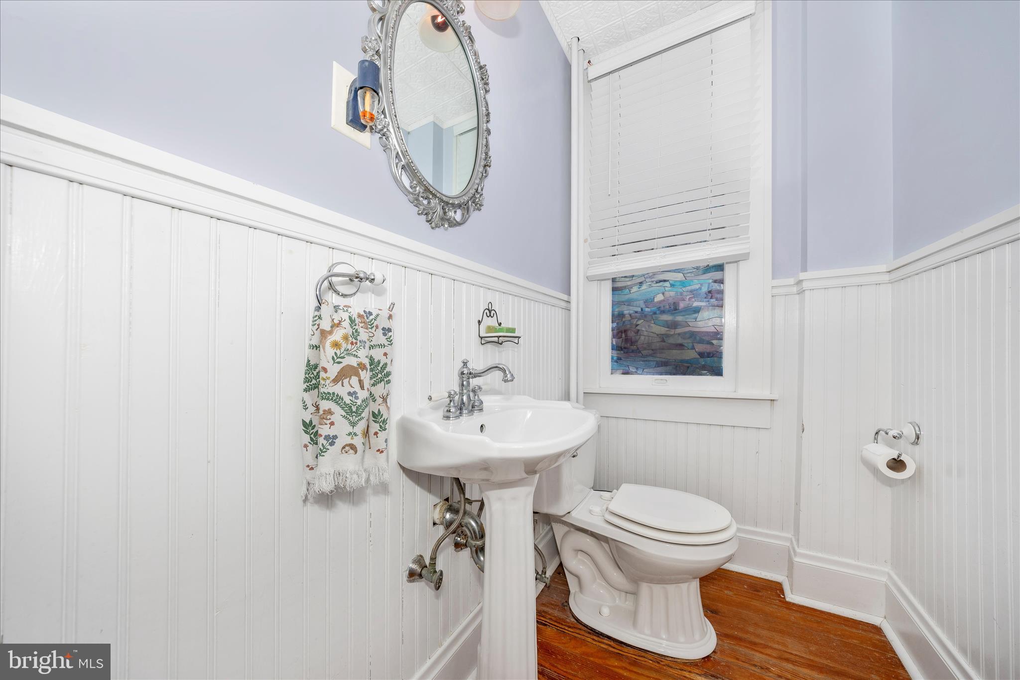 707 Summit Avenue Hagerstown, MD 21740 - Photo 21 of 54 a bathroom with a toilet sink and mirror