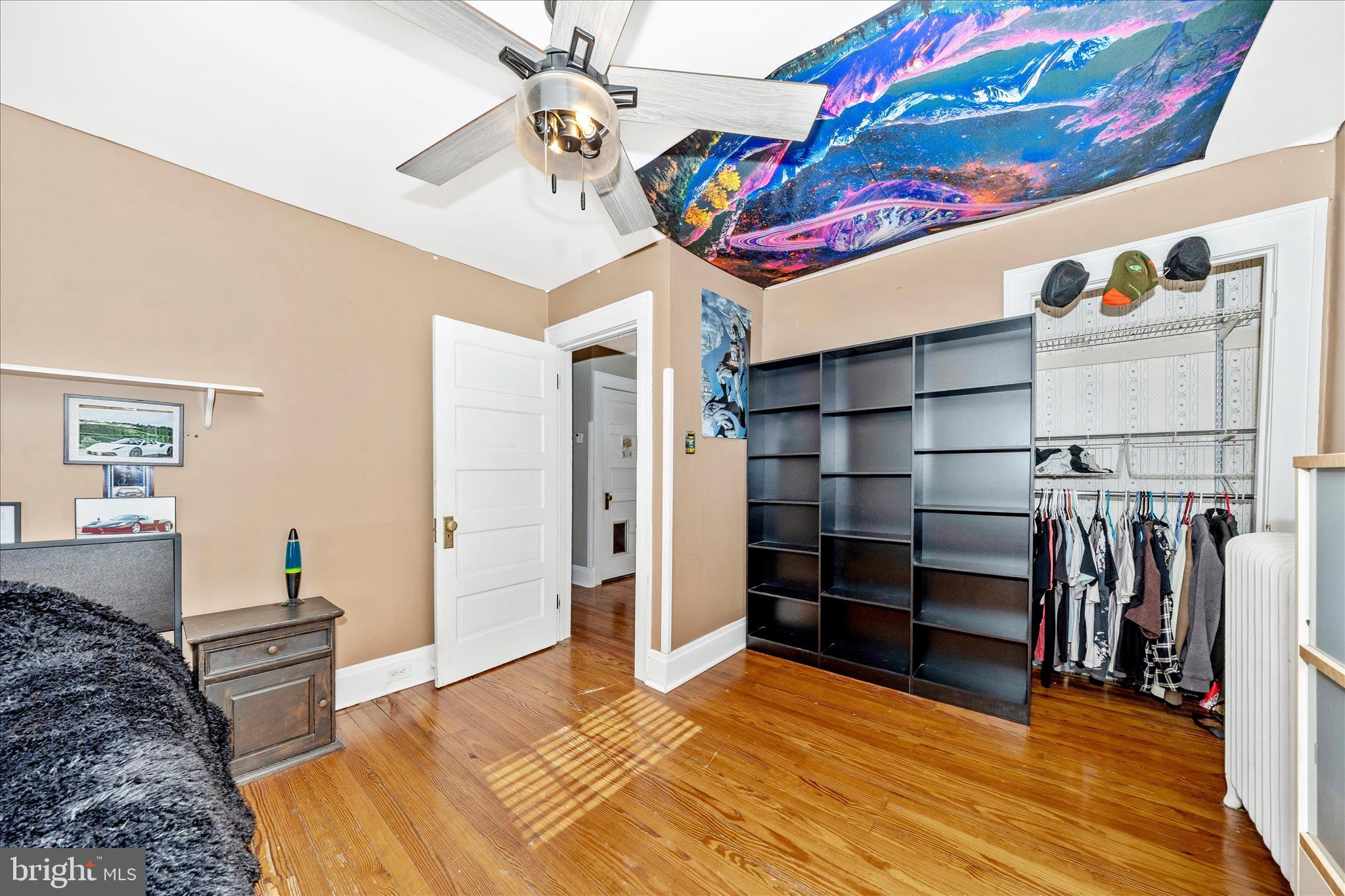 707 Summit Avenue Hagerstown, MD 21740 - Photo 33 of 54 a bedroom with a bed and a chandelier