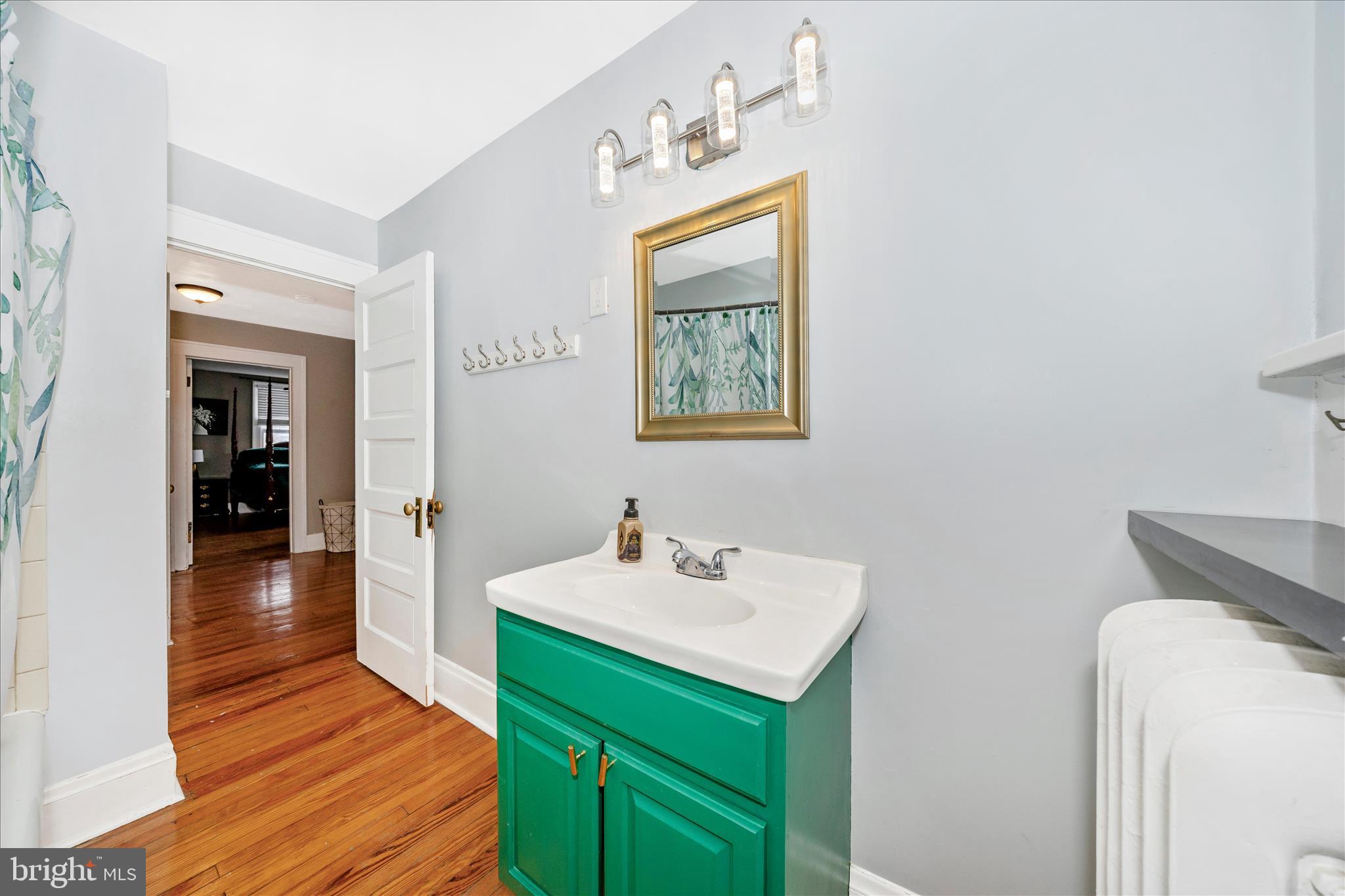707 Summit Avenue Hagerstown, MD 21740 - Photo 38 of 54 a bathroom with a sink and a mirror