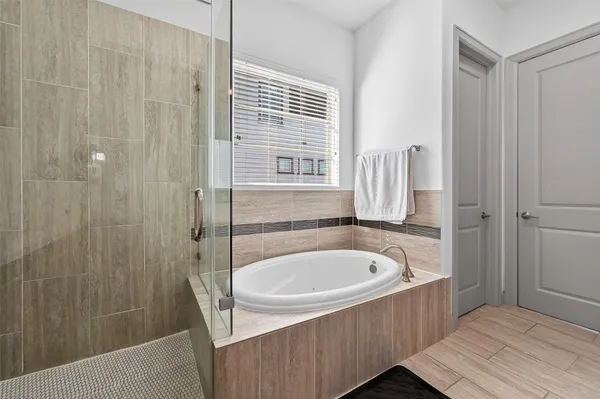 a bathroom with a granite countertop sink a shower and a mirror