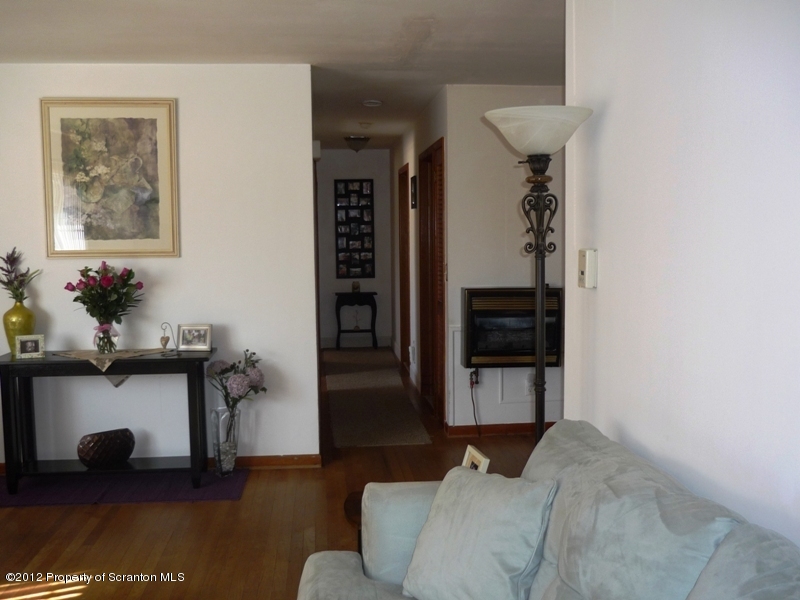 891 St Rt 502 Spring Brook Moscow, PA 18444 - Photo 14 of 41 a living room with furniture and wooden floor