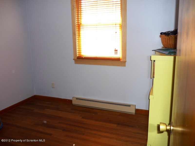 891 St Rt 502 Spring Brook Moscow, PA 18444 - Photo 16 of 41 a room with a window
