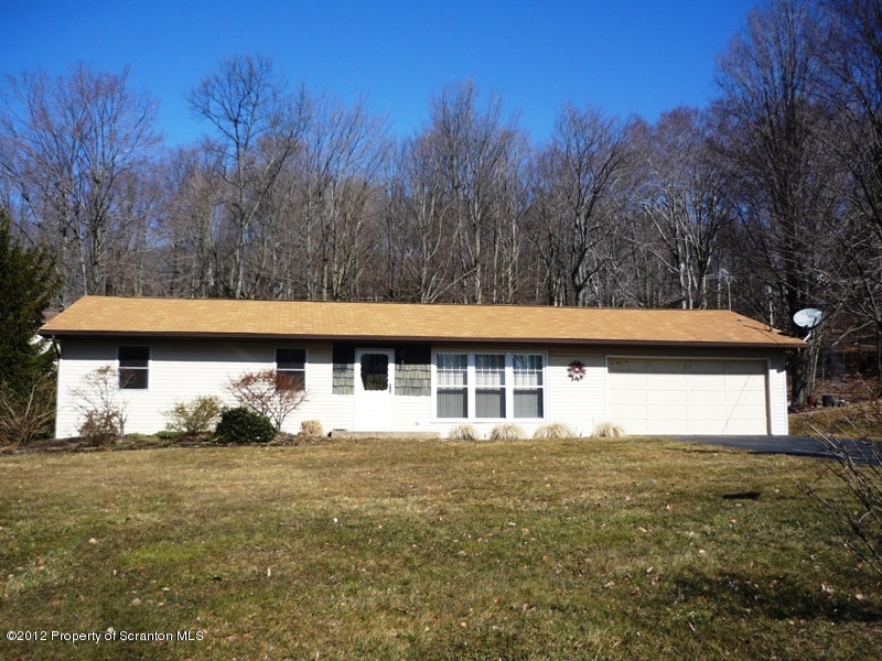 891 St Rt 502 Spring Brook Moscow, PA 18444 - Photo 29 of 41 a front view of a house with a yard