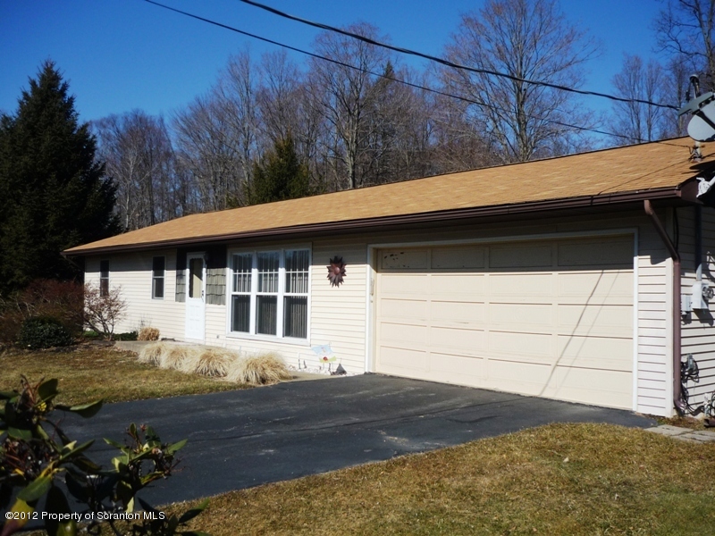 891 St Rt 502 Spring Brook Moscow, PA 18444 - Photo 30 of 41 a front view of house with yard