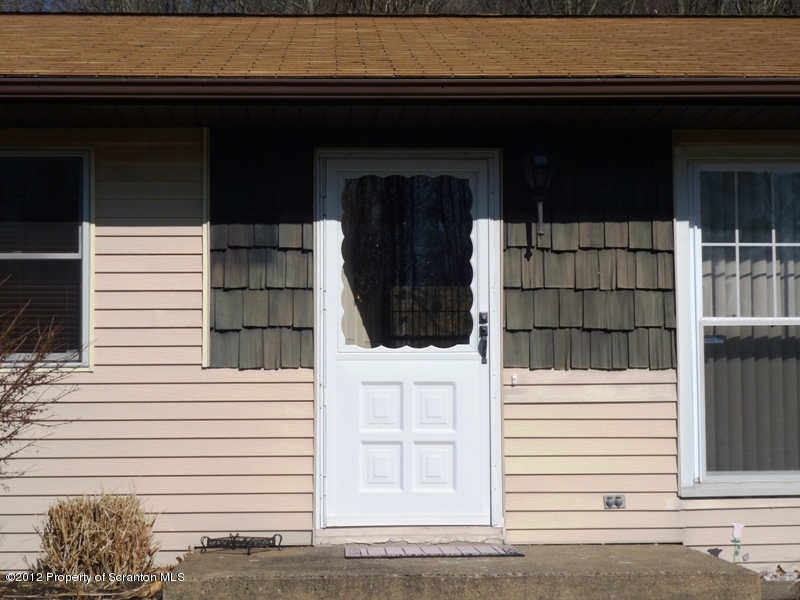 891 St Rt 502 Spring Brook Moscow, PA 18444 - Photo 6 of 41 a view of a door of the house