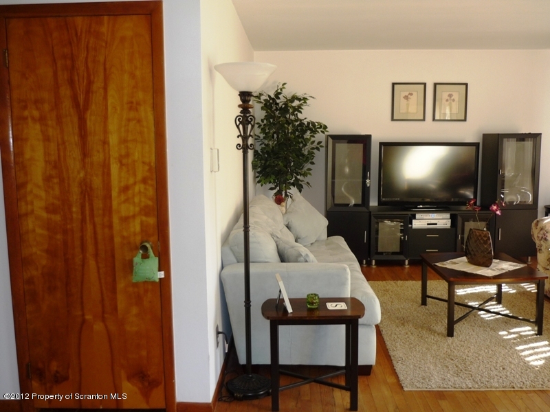 891 St Rt 502 Spring Brook Moscow, PA 18444 - Photo 8 of 41 a living room with furniture and a flat screen tv