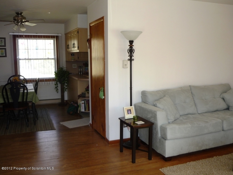 891 St Rt 502 Spring Brook Moscow, PA 18444 - Photo 10 of 41 a living room with furniture and a wooden floor