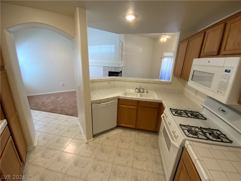 7400 West Flamingo Road, Unit 1039 Las Vegas, NV 89147 - Photo 24 of 40 Functional kitchen with ample counter space and a convenient pass-through to the living area.
