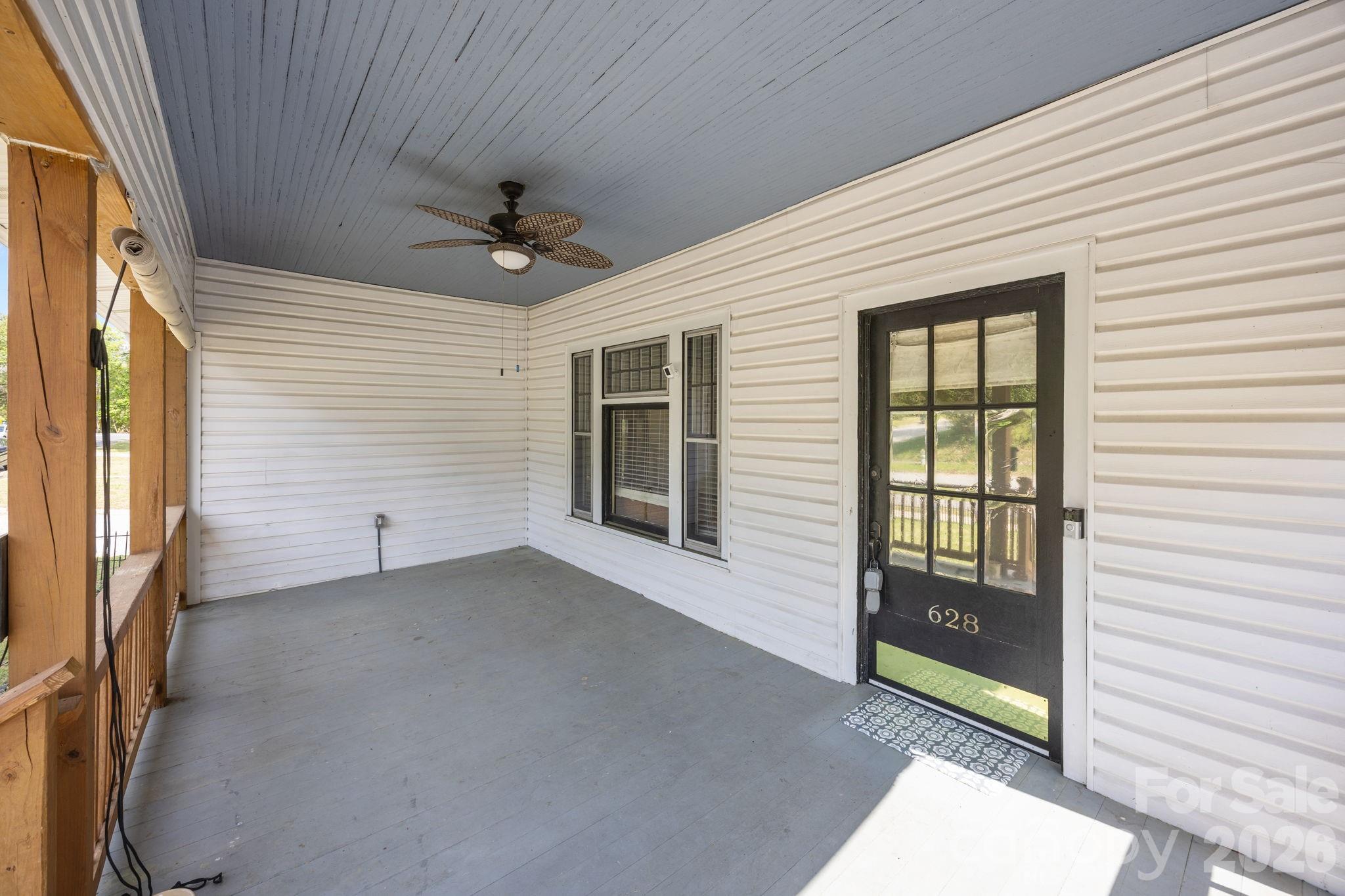 628 West Council Street Salisbury, NC 28144 - Photo 12 of 43 a view of a porch with wooden floor and a ceiling fan