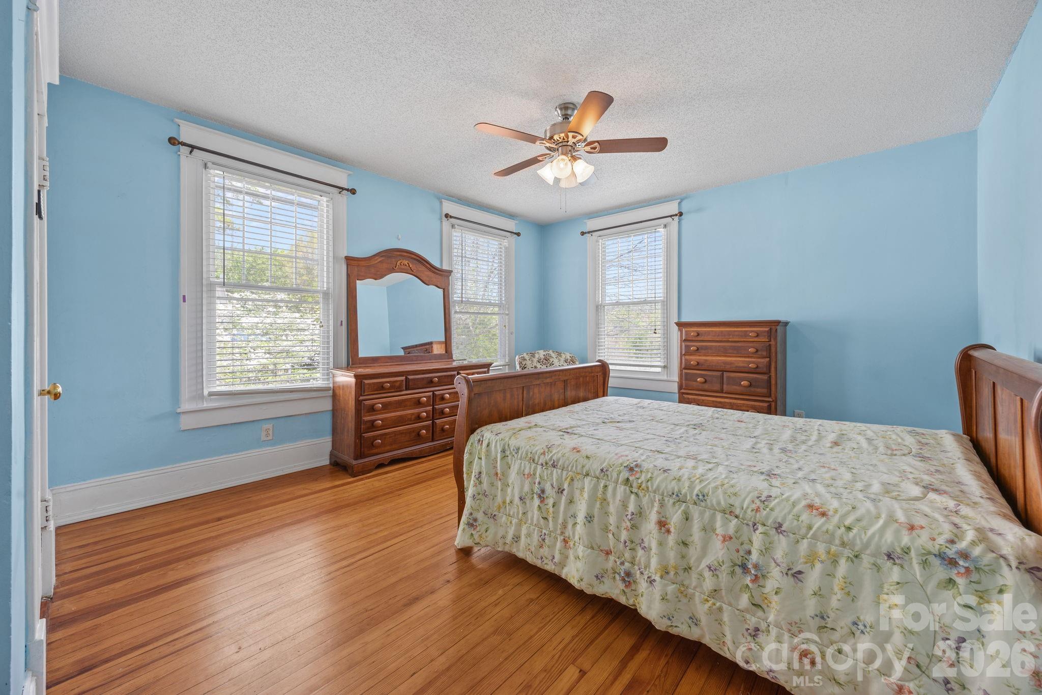 628 West Council Street Salisbury, NC 28144 - Photo 23 of 43 a bedroom with a large bed and a window