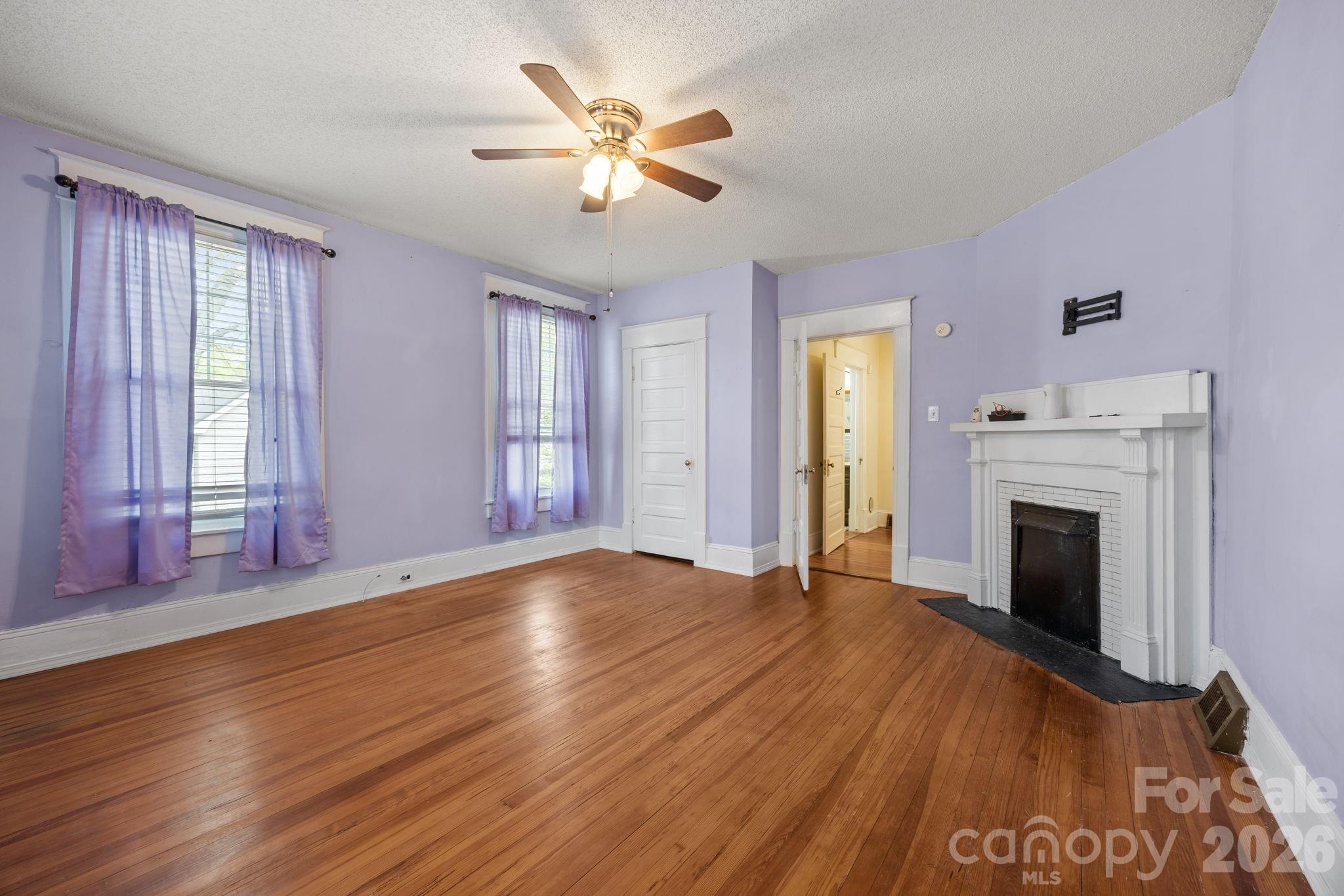 628 West Council Street Salisbury, NC 28144 - Photo 25 of 43 a view of an empty room with window and wooden floor