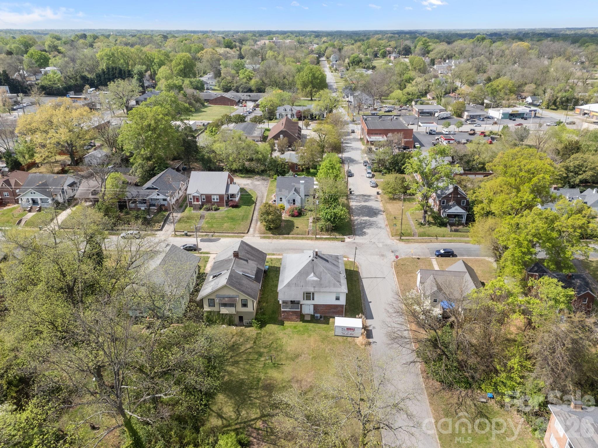628 West Council Street Salisbury, NC 28144 - Photo 5 of 43 an aerial view of residential houses with outdoor space and trees