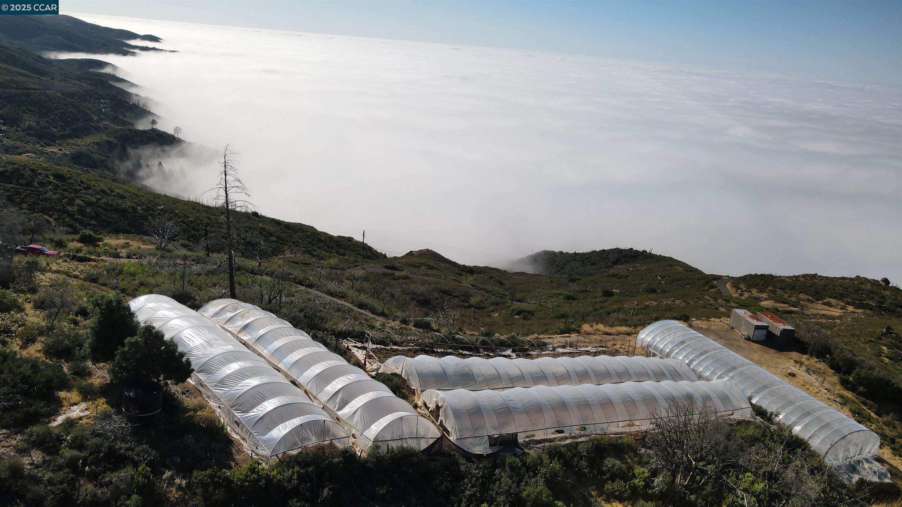 12700 Pine Flat Road Cloverdale, CA 95425 - Photo 13 of 20 a view of a house with a mountain in the background