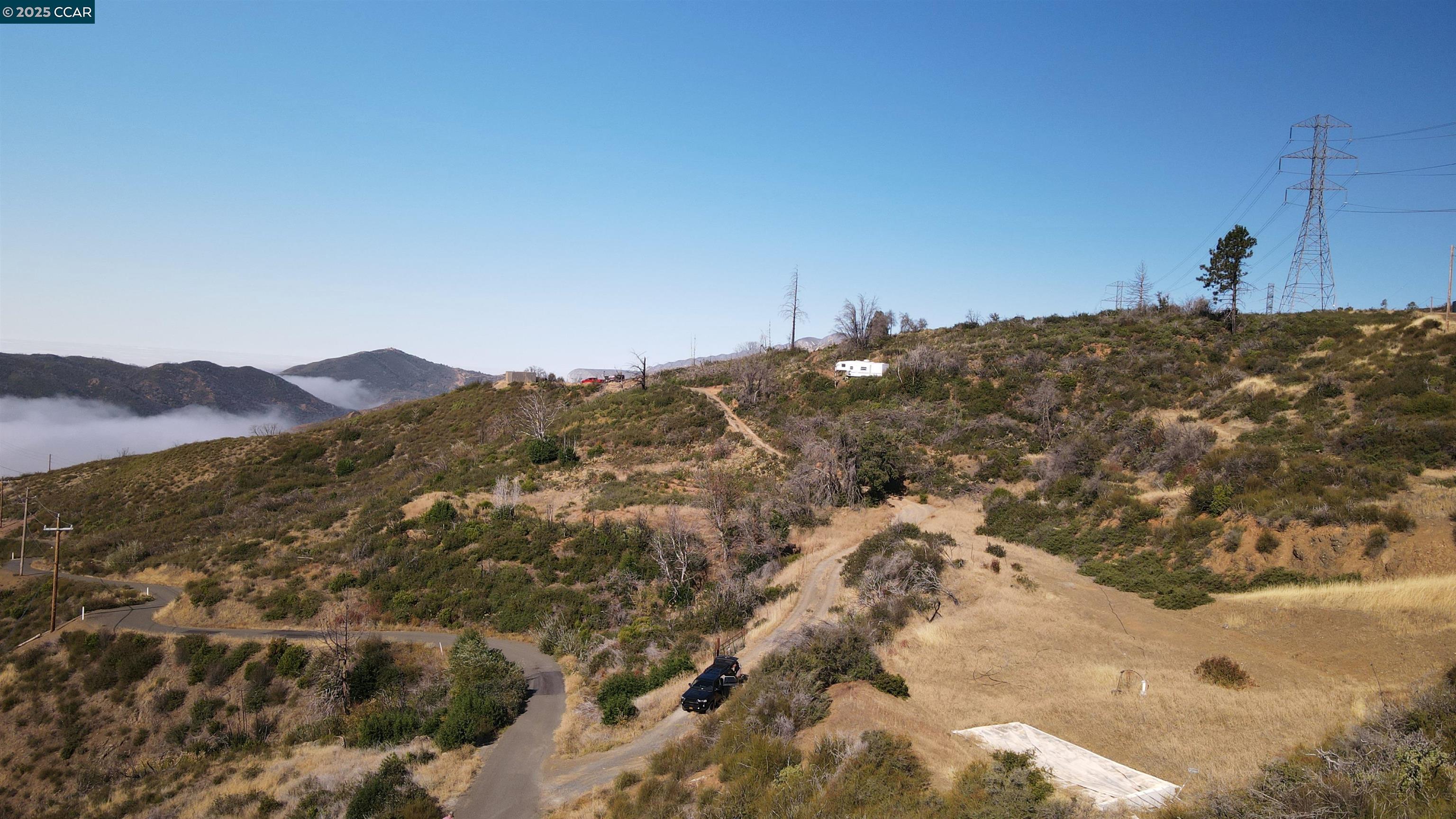12700 Pine Flat Road Cloverdale, CA 95425 - Photo 7 of 20 a view of a dry yard with mountains in the background