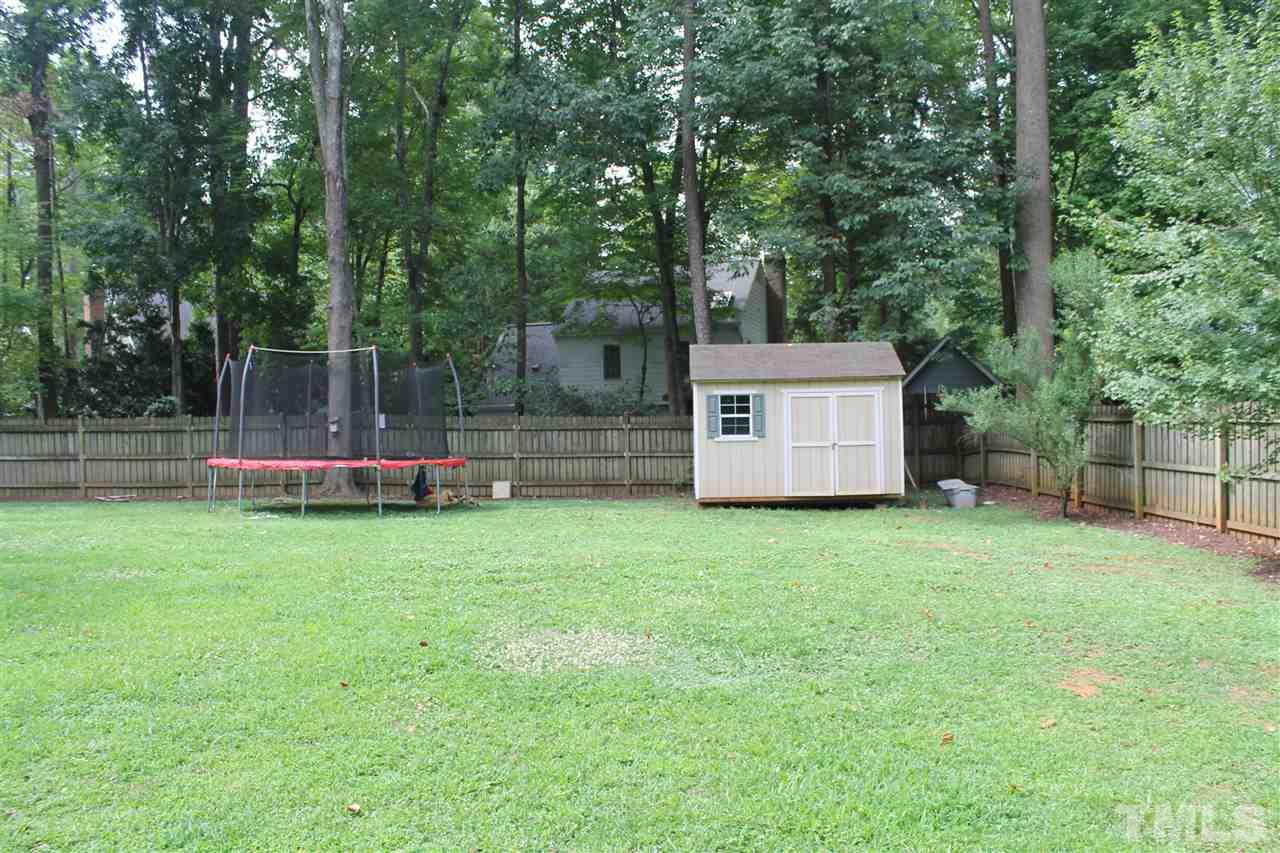 4401 Pike Road Raleigh, NC 27613 - Photo 14 of 14 a view of a backyard with small cabin