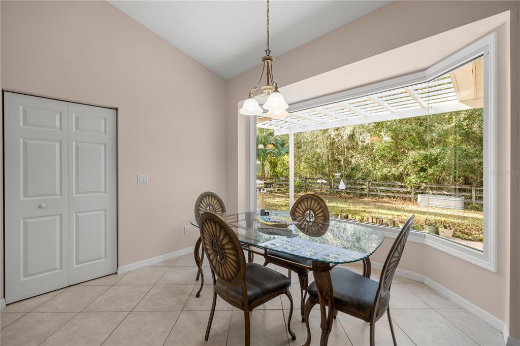 19040 Northwest 88th Avenue Road Reddick, FL 32686 - Photo 11 of 68 a dining room with furniture window and outside view