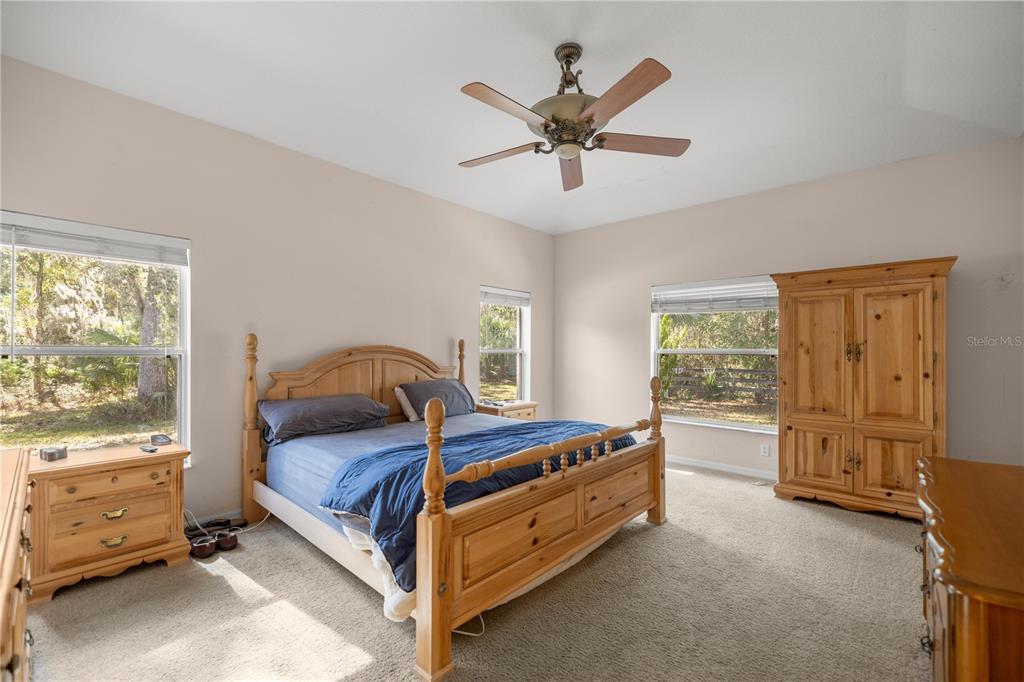 19040 Northwest 88th Avenue Road Reddick, FL 32686 - Photo 20 of 68 a bed room with a bed and a window