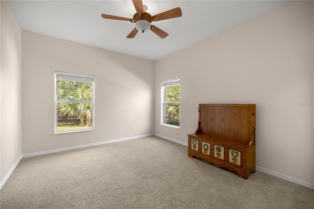 19040 Northwest 88th Avenue Road Reddick, FL 32686 - Photo 25 of 68 a view of a room with window and a ceiling fan