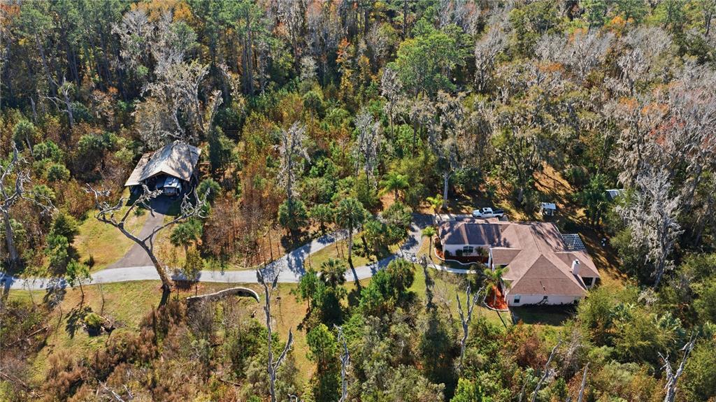 19040 Northwest 88th Avenue Road Reddick, FL 32686 - Photo 59 of 68 an aerial view of residential house with outdoor space and trees all around