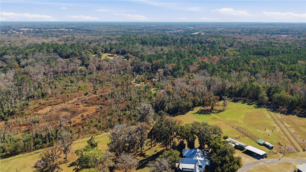 19040 Northwest 88th Avenue Road Reddick, FL 32686 - Photo 64 of 68 a view of a city with mountains in the background