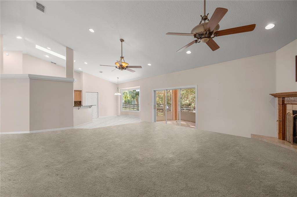 19040 Northwest 88th Avenue Road Reddick, FL 32686 - Photo 10 of 68 a view of a livingroom with a ceiling fan and window