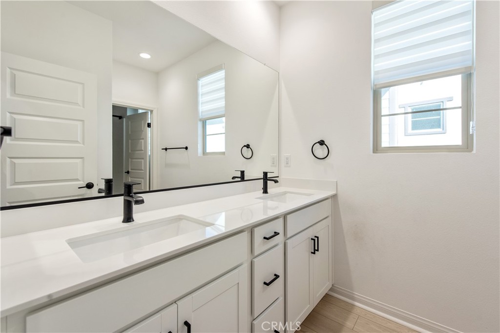 781 Cornelia Way Rancho Mission Viejo, CA 92694 - Photo 17 of 24 a bathroom with a sink and a mirror