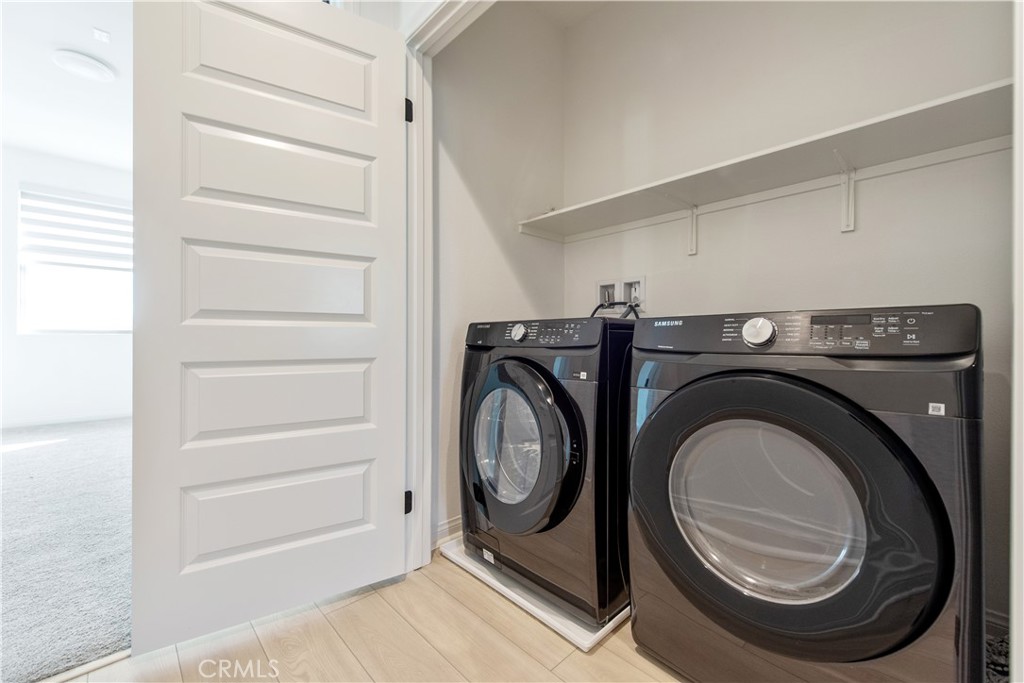 781 Cornelia Way Rancho Mission Viejo, CA 92694 - Photo 19 of 24 a utility room with dryer and washer