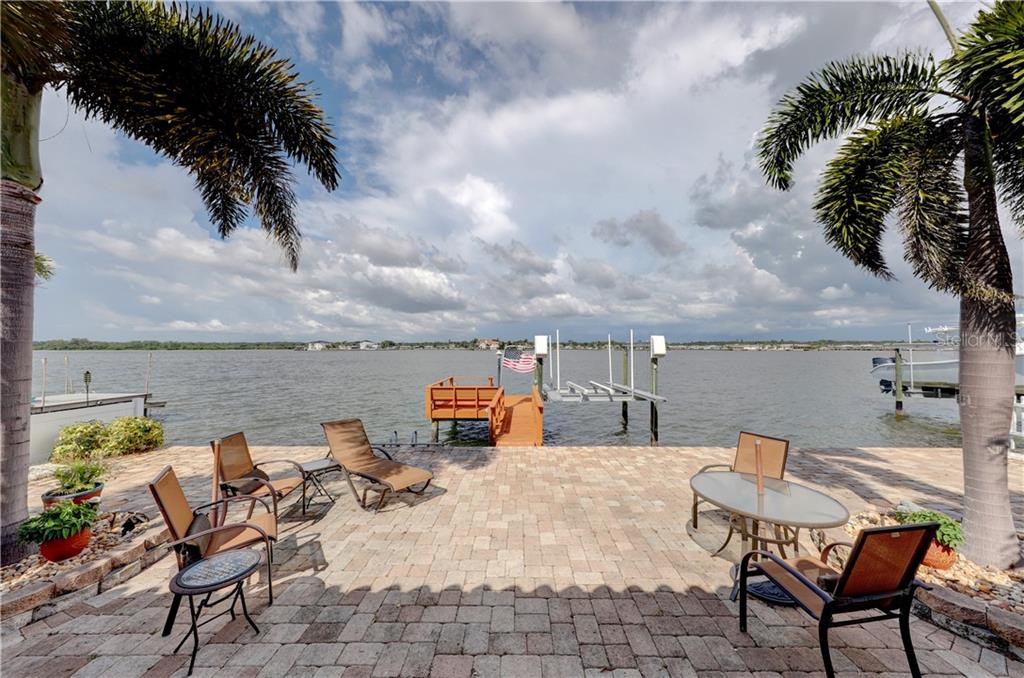 16009 6th Street East Redington Beach, FL 33708 - Photo 1 of 1 a terrace of a house with outdoor seating