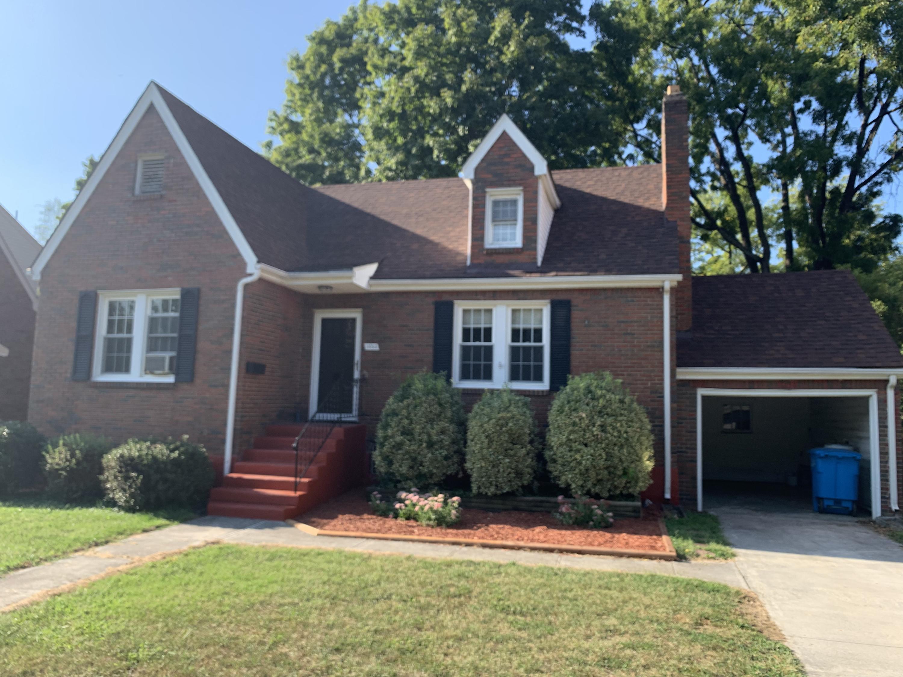 1668 Brandon Avenue Southwest Roanoke, VA 24015 - Photo 1 of 24 front view of a house with a yard