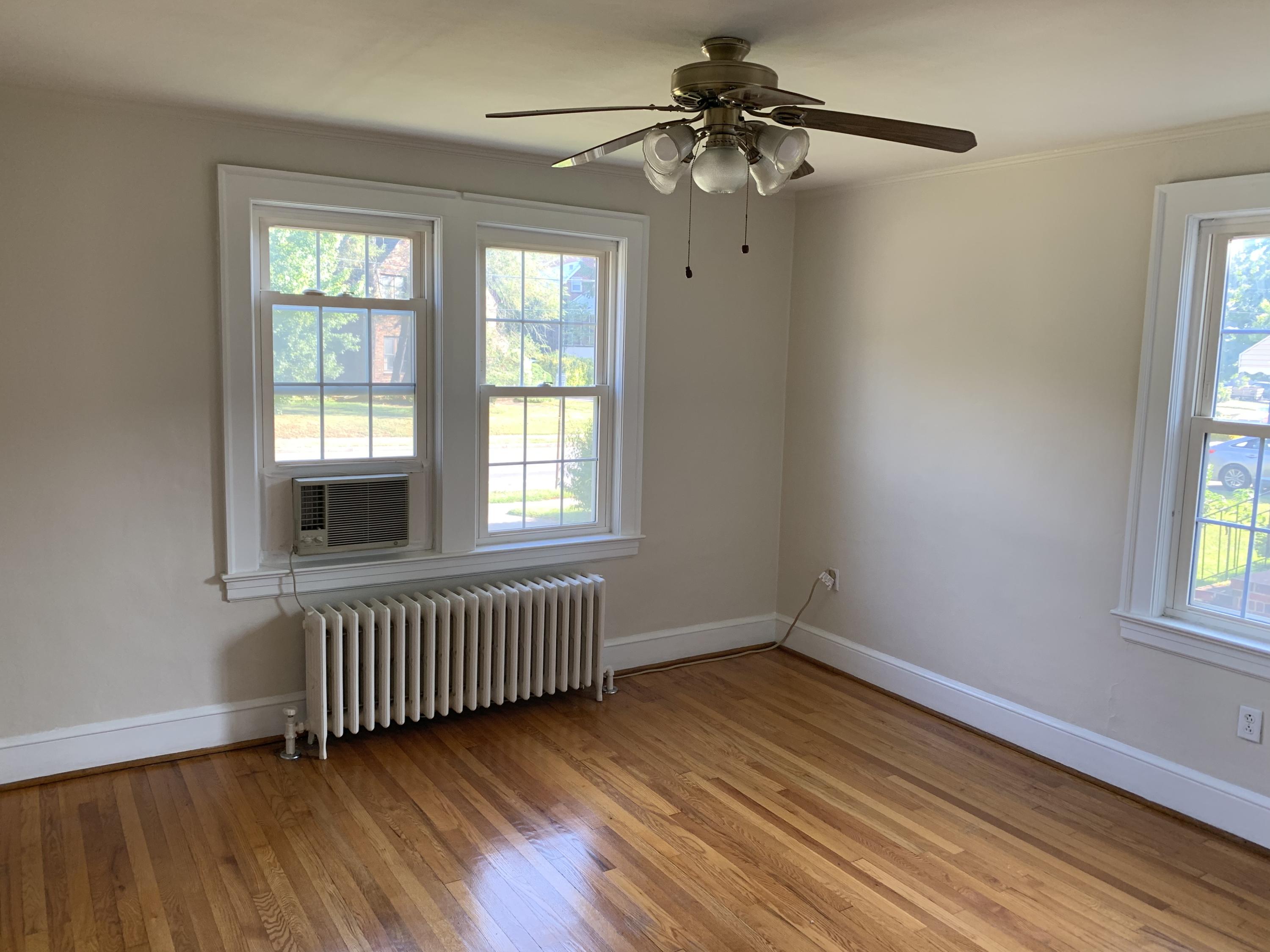 1668 Brandon Avenue Southwest Roanoke, VA 24015 - Photo 13 of 24 wooden floor in an empty room with a window