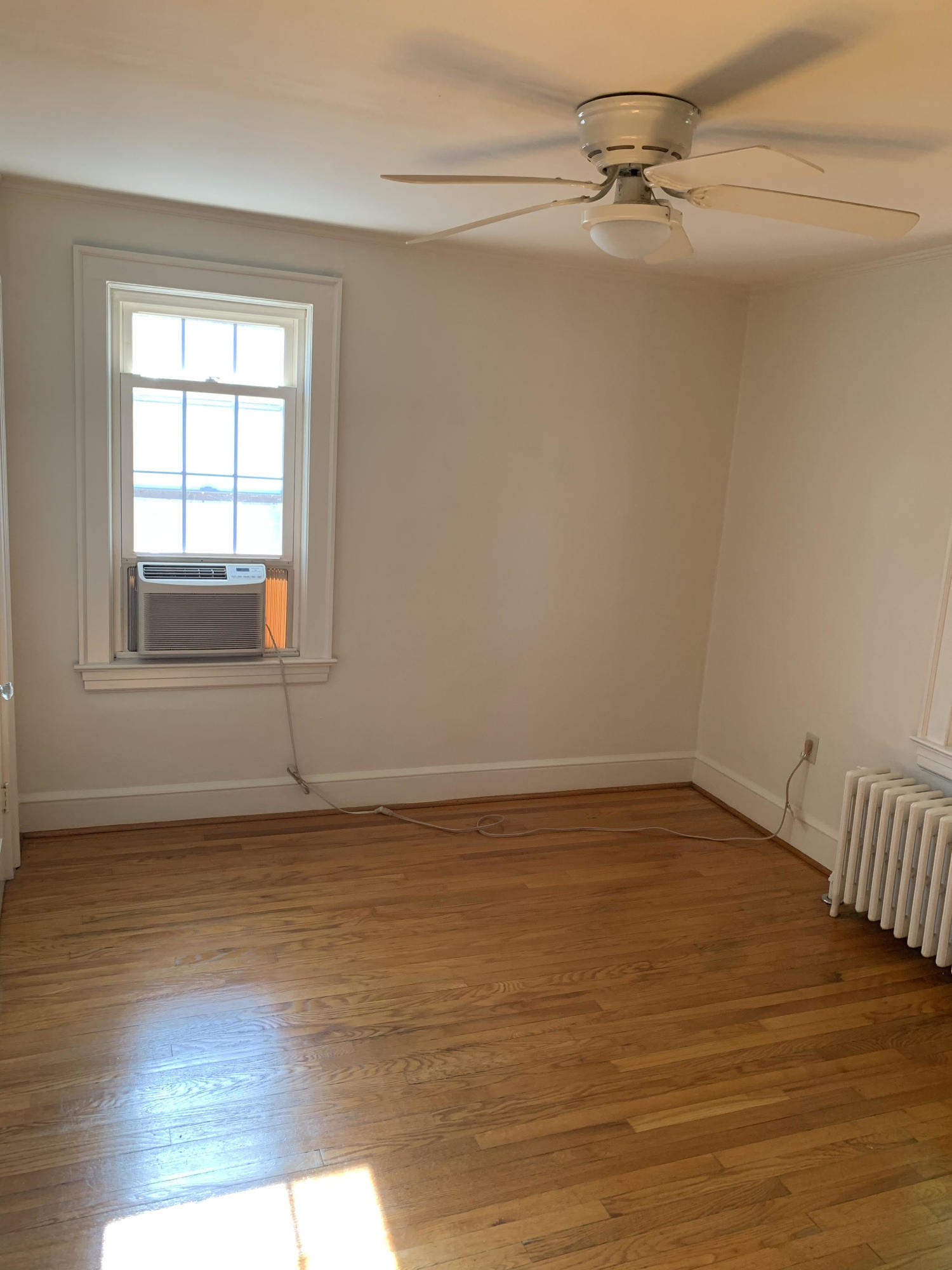 1668 Brandon Avenue Southwest Roanoke, VA 24015 - Photo 16 of 24 a view of empty room with wooden floor and fan