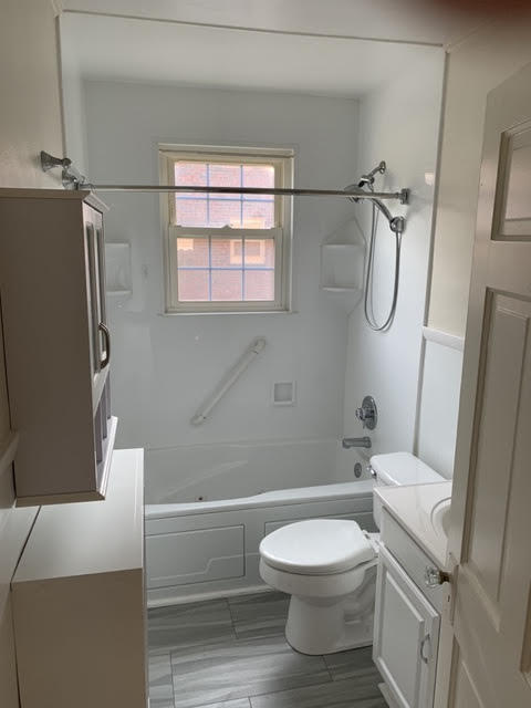 1668 Brandon Avenue Southwest Roanoke, VA 24015 - Photo 17 of 24 a bathroom with a toilet sink and shower
