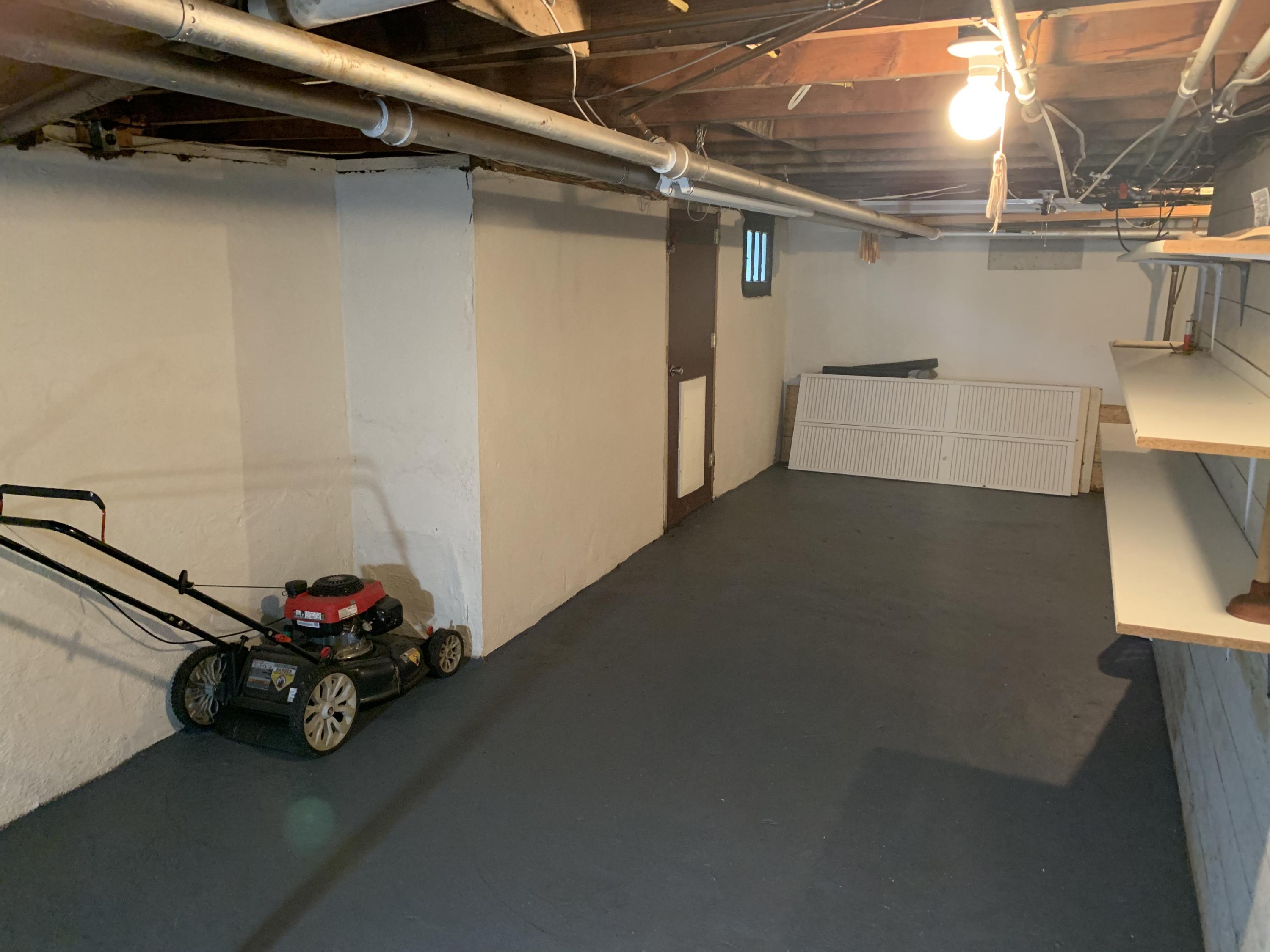 1668 Brandon Avenue Southwest Roanoke, VA 24015 - Photo 23 of 24 a view of a room with racks on the wall