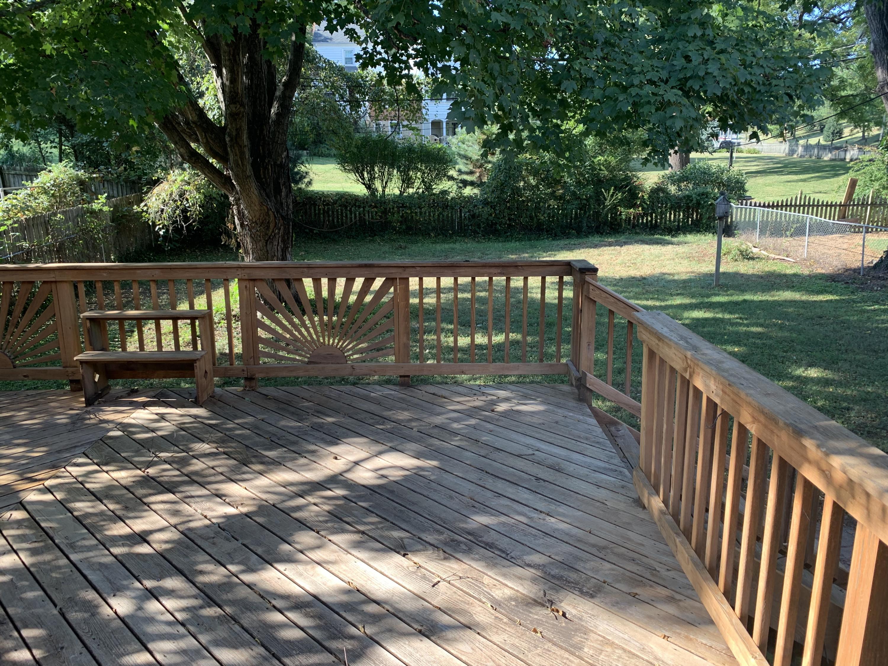 1668 Brandon Avenue Southwest Roanoke, VA 24015 - Photo 4 of 24 a view of deck with wooden floor and fence next to a yard