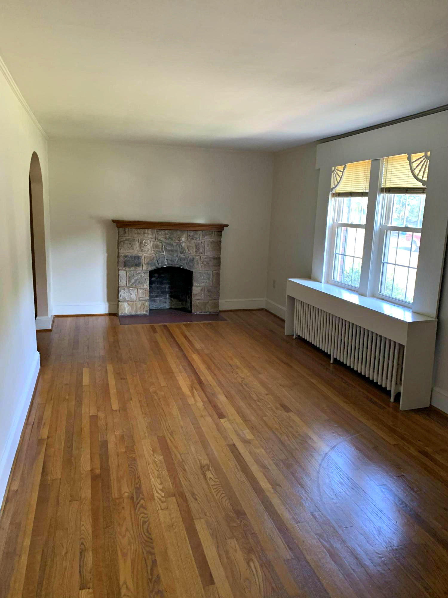 1668 Brandon Avenue Southwest Roanoke, VA 24015 - Photo 7 of 24 wooden floor in a room with a fireplace
