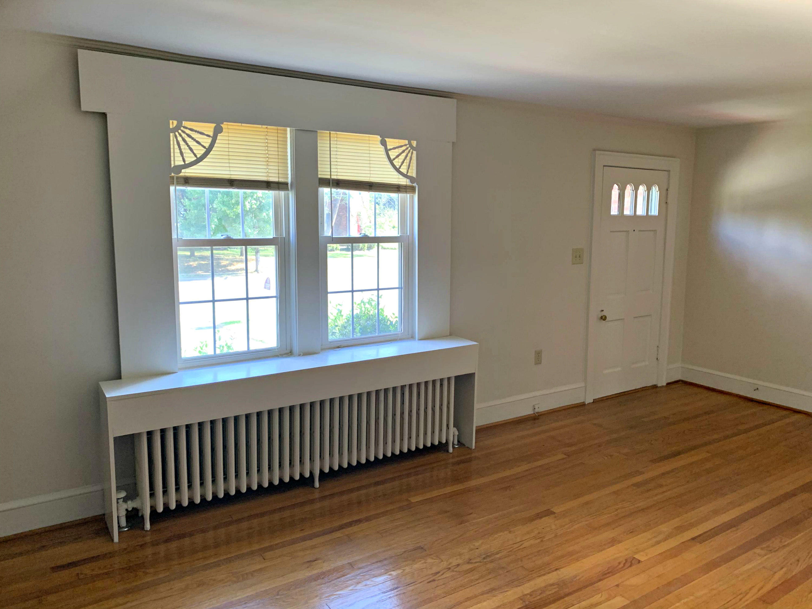 1668 Brandon Avenue Southwest Roanoke, VA 24015 - Photo 8 of 24 wooden floor in an empty room with a window
