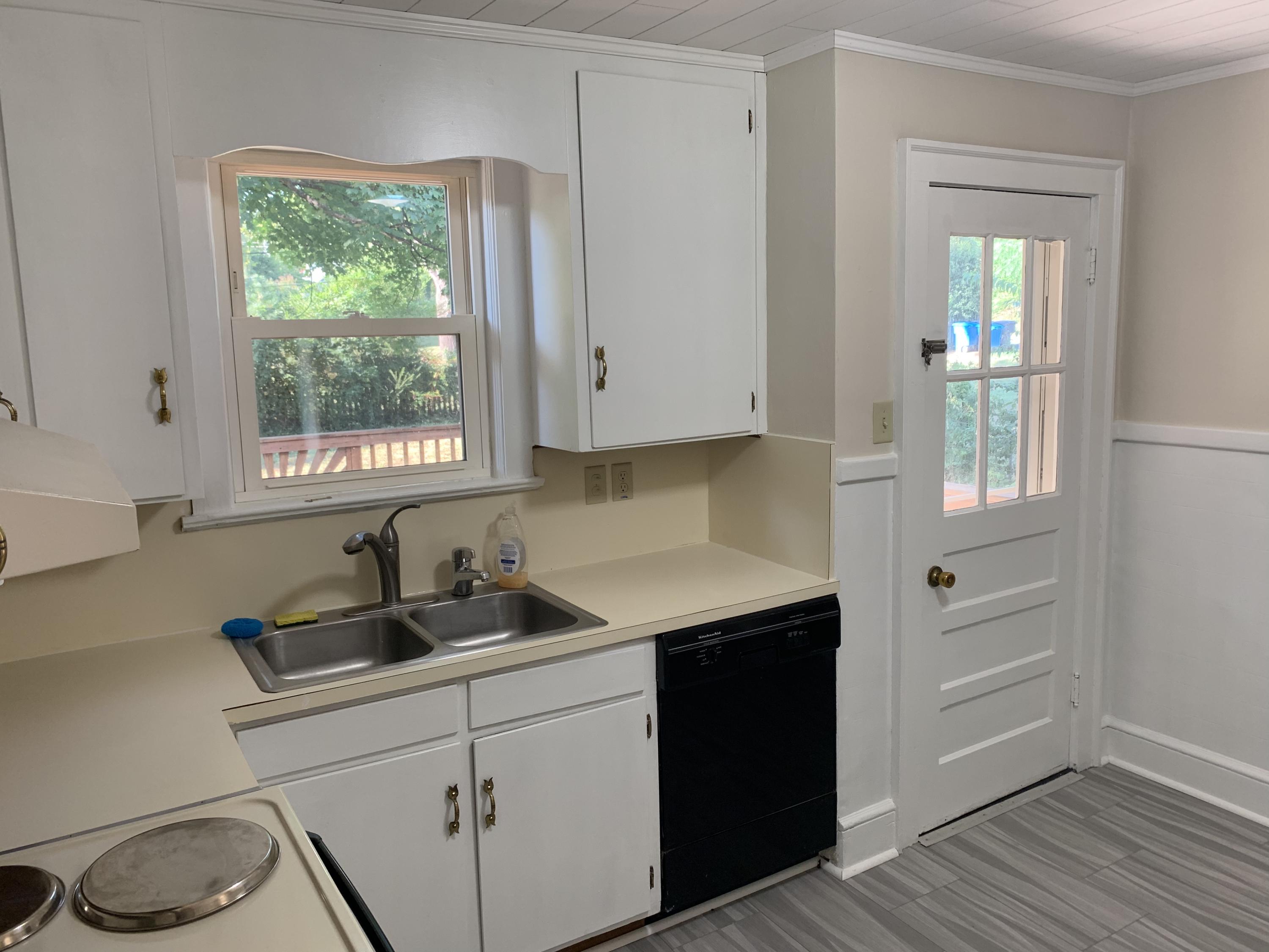 1668 Brandon Avenue Southwest Roanoke, VA 24015 - Photo 9 of 24 a kitchen with a sink and cabinets
