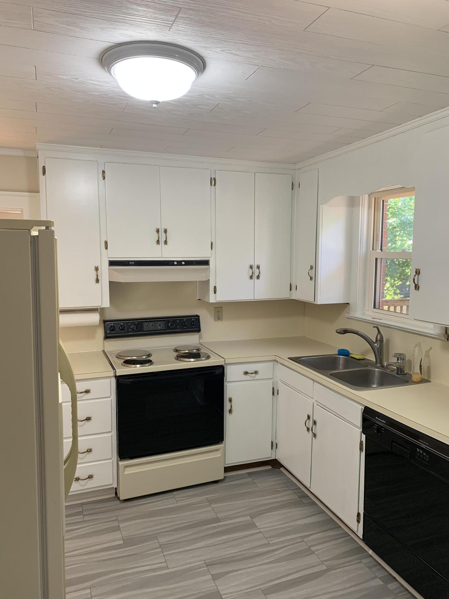 1668 Brandon Avenue Southwest Roanoke, VA 24015 - Photo 10 of 24 a kitchen with stainless steel appliances granite countertop a stove and a sink