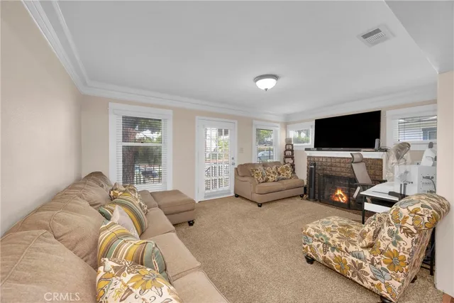 a living room with a couch and a window