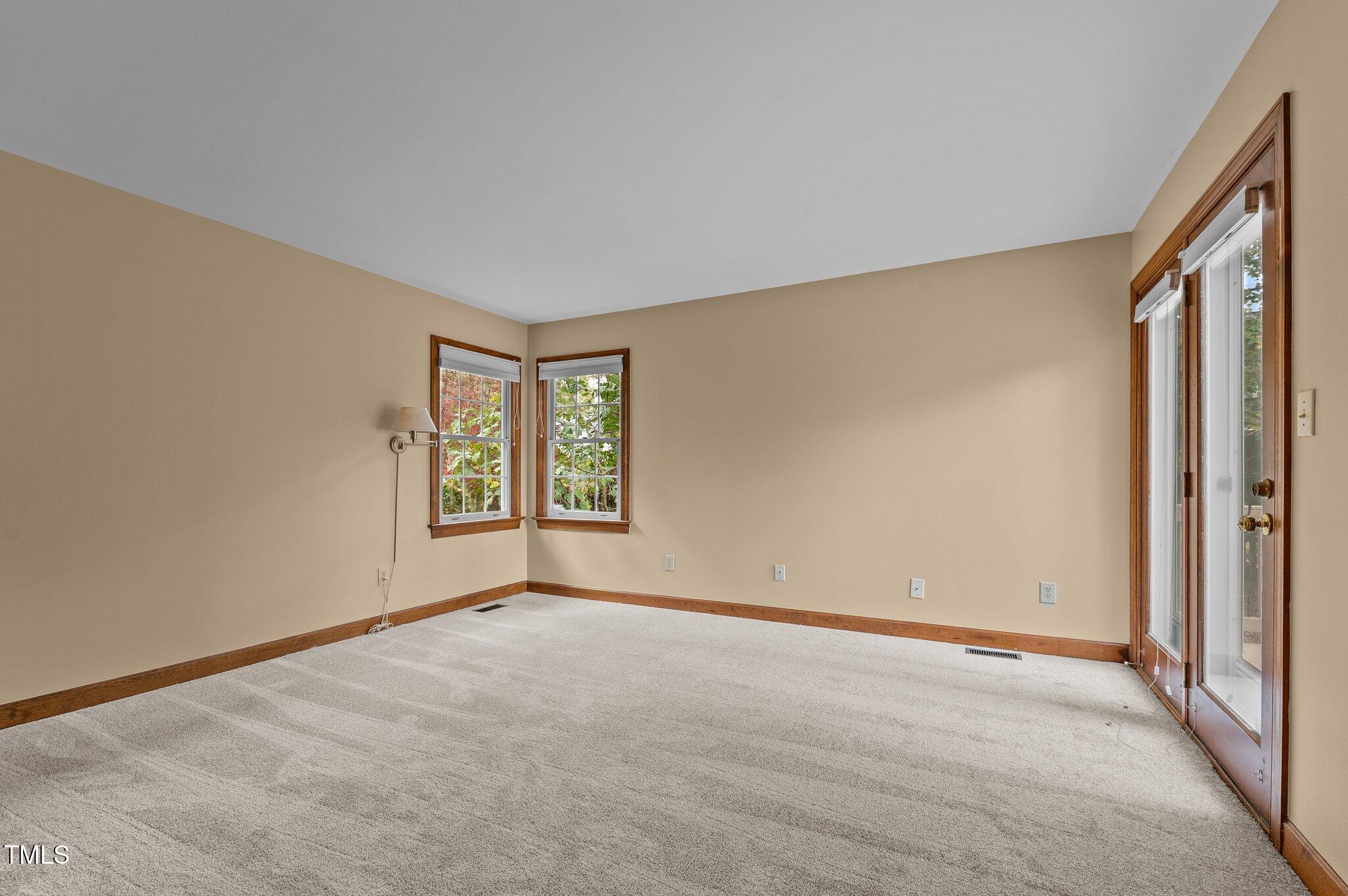 5621 Raddington Street Raleigh, NC 27613 - Photo 26 of 34 Bedroom 2 with Deck Access