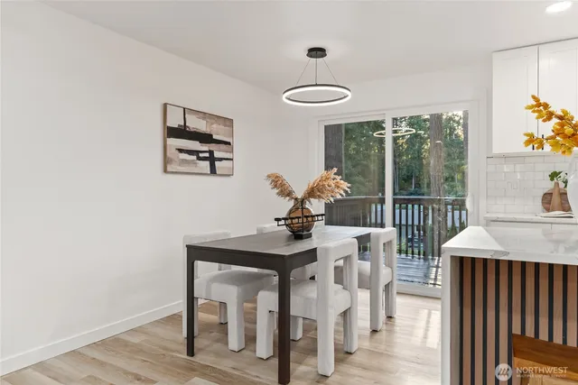a view of a dining room with furniture window and outside view