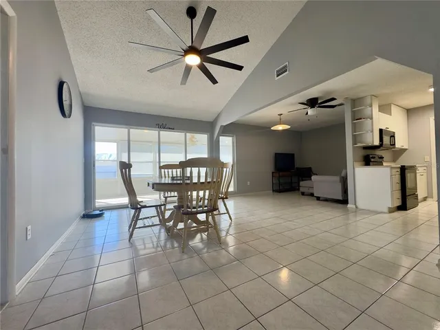 a bathroom with a mirror a shower and a sink