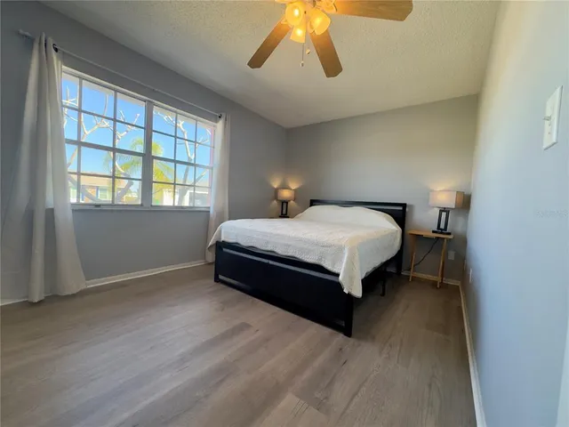 a view of a white house with a yard