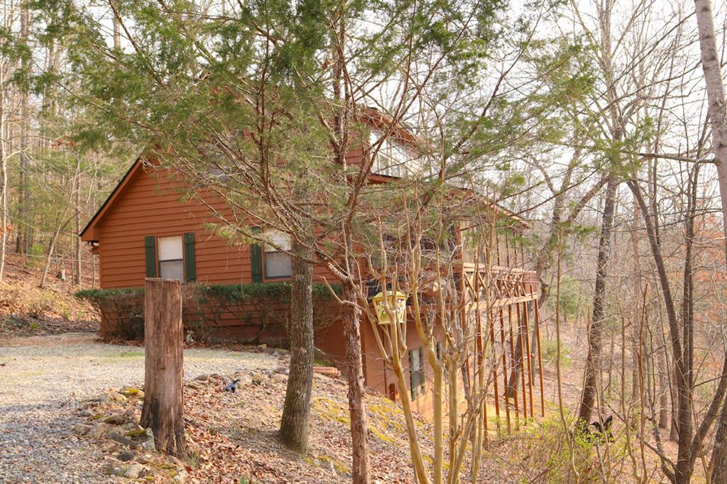 39 Thomas Ridge Lane Blairsville, GA 30512 - Photo 1 of 19 a view of a wooden house with a large tree